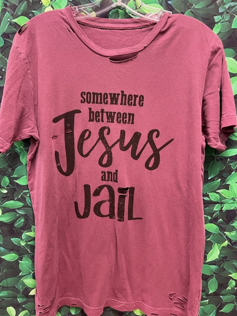 Somewhere Between Jesus and Jail maroon color destroyed tee