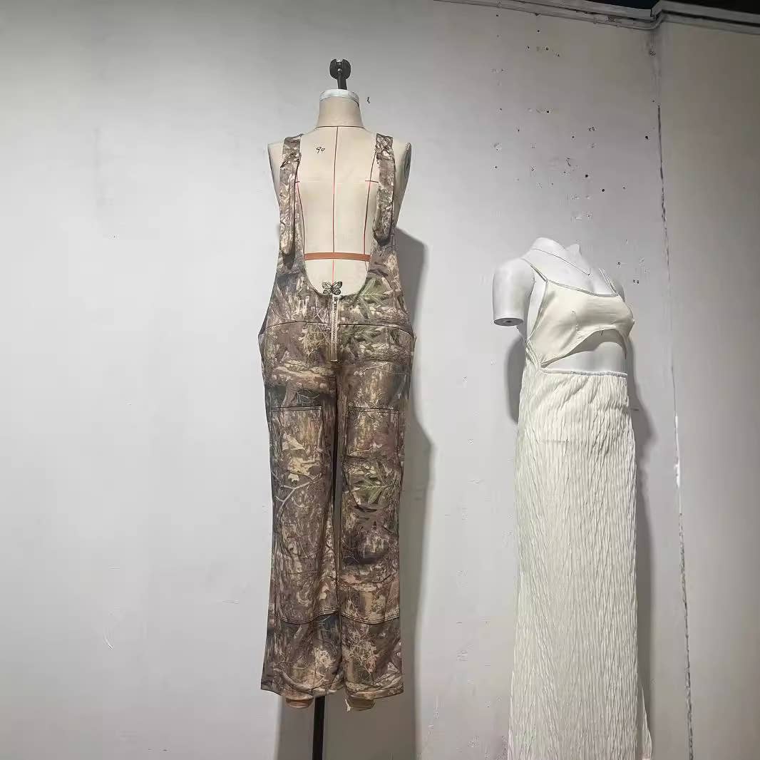 Low-rise bib jumpsuit distressed straight-leg printed pants